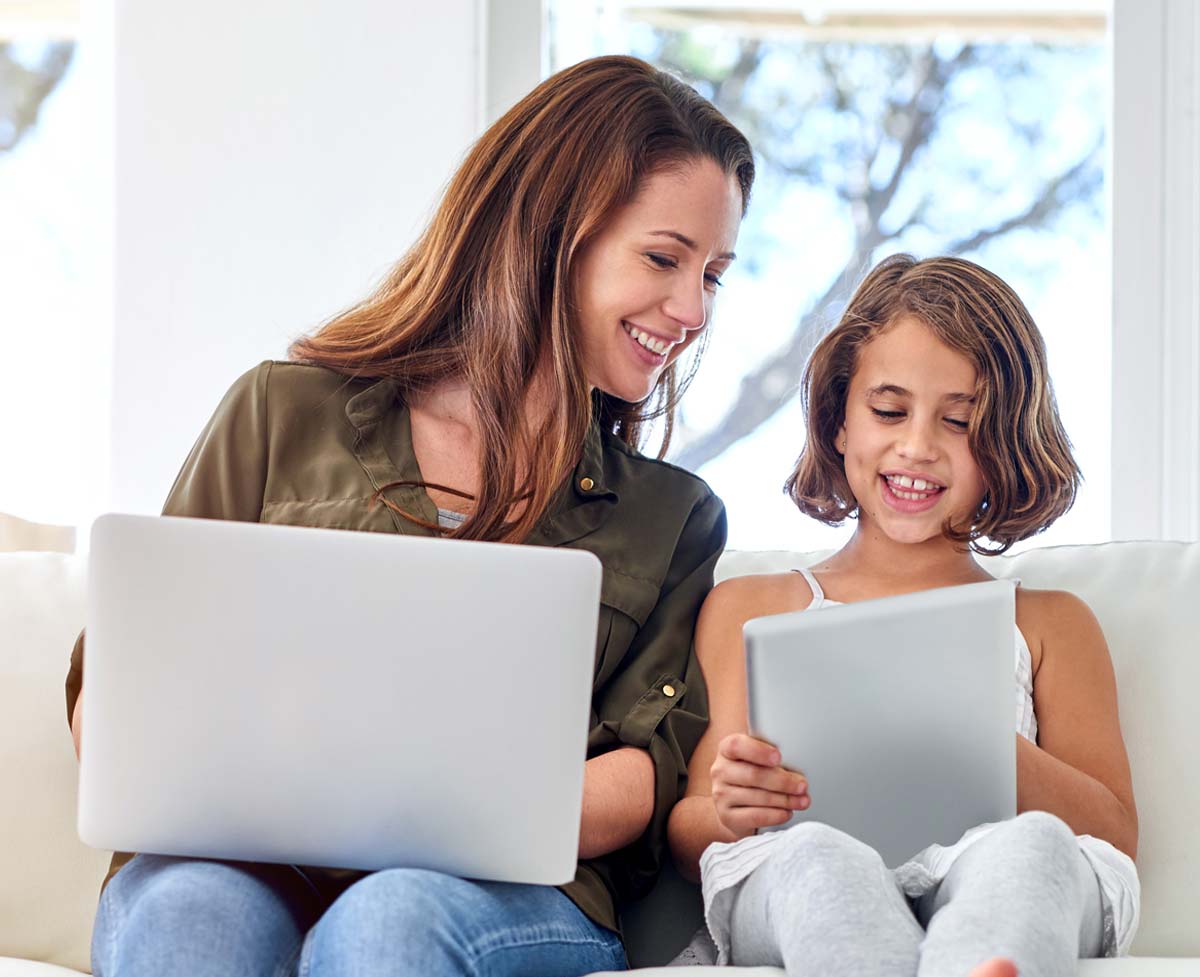 A mother and daughter checking their MeMail email accounts.